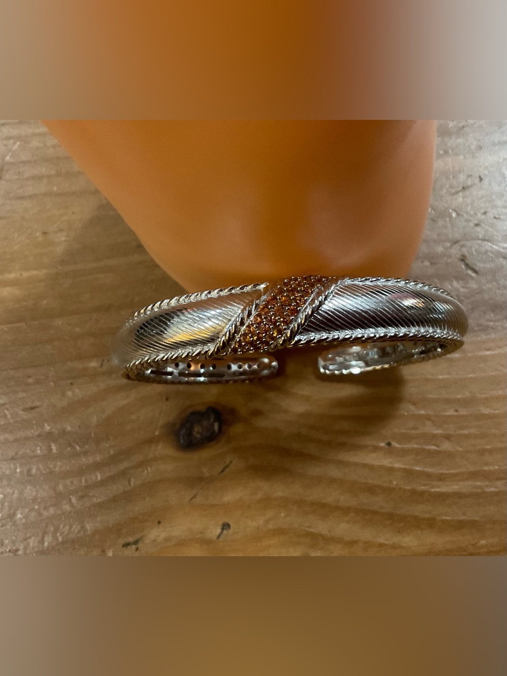 Judith Ripka: hinged (925) Silver Cuff Bracelet with orange/amber ish sapphires.